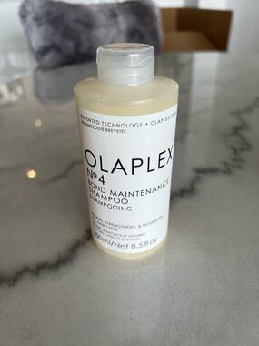 OLAPLEX No.4 Bond Maintenance Shampoo - White Bottle with Cream Liquid